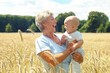 Grandmother with child on her arm