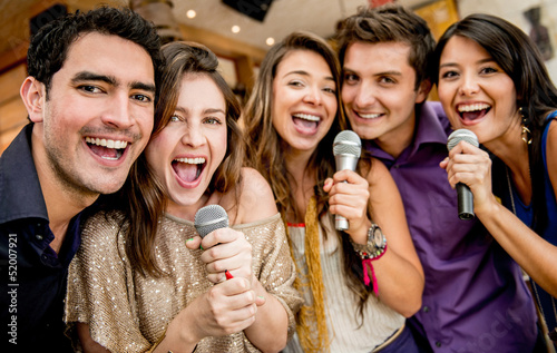 Photo: Group of friends singing Group of friends singing