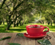 cup of fresh coffee with coffee beans on wooden table