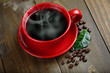 cup of fresh coffee with coffee beans on wooden table