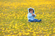 boy in spring flowers field