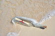 Photo: Bottle with a message on the beach Bottle with a message on the beach