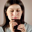 Photo: Young woman with with a chocolate bar Young woman with with a chocolate bar