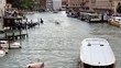 Channel in Venice with cruising boats on it