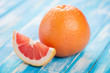 Ripe grapefruit on wooden boards, horizontal shot