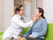  doctor examining mature woman
