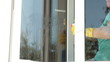 Video: Woman cleaning the window at home Woman cleaning the window at home
