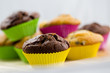 Photo: Muffins - homemade cupcakes in colorful molds Muffins - homemade cupcakes in colorful molds