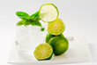 Limes, refreshing drink with ice