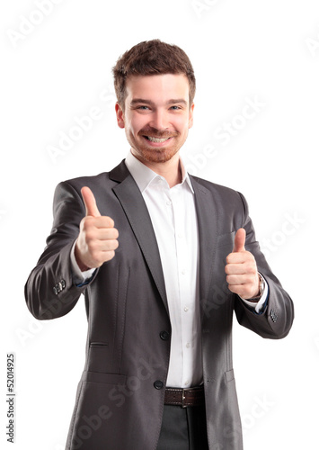 Photo: Happy smiling young business man with thumbs up gesture Happy smiling young business man with thumbs up gesture