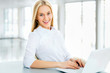 Young business woman using laptop