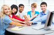 Students showing unity with their hands together