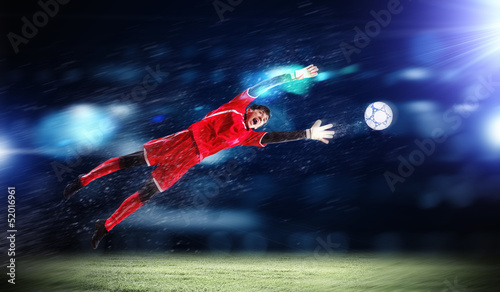 Photo: Goalkeeper catches the ball Goalkeeper catches the ball