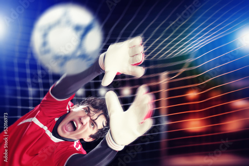 Photo: Goalkeeper catches the ball Goalkeeper catches the ball