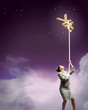 Image of businesswoman climbing the rope