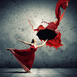 Ballet dancer in flying satin dress with umbrella