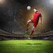 Photo: football player striking the ball football player striking the ball