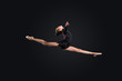 Young woman in gymnast suit posing