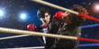 Two young businessman boxing