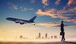 Business woman looking at airplane in sky