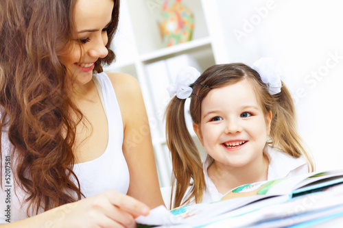 Photo: Mother and daughter studying Mother and daughter studying