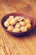 full bowl of walnuts on the wooden table