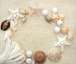 Foto: Starfishes and conches on canvas texture Starfishes and conches on canvas texture