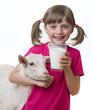 little girl drinking healthy goat milk
