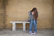 Lonely woman crying of the bench