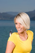 Beautiful blond woman at the coast