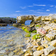 Photo: Rocky shore against a blue sky Rocky shore against a blue sky