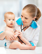 baby and doctor pediatrician. doctor listens to the heart with s