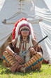 Photo: North American Indian in full dress. Reconstruction North American Indian in full dress. Reconstruction