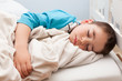Young kid boy sleeping and dreaming peacfully