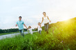 Photo: happy family having fun outdoors happy family having fun outdoors