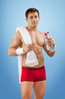 Photo: a young sportsman with bottle of water a young sportsman with bottle of water