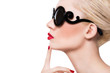 Beautiful blonde girl in sunglasses with red lips on white backg