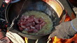Cooking pilaf. Fold meat