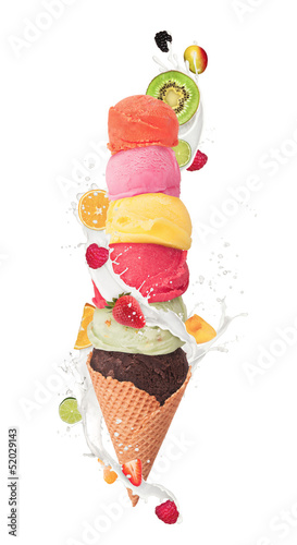 Photo: Ice cream with milk splash and pieces of fruit on white backgrou Ice cream with milk splash and pieces of fruit on white backgrou