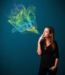 Photo: Pretty lady smoking cigarette with colorful smoke Pretty lady smoking cigarette with colorful smoke
