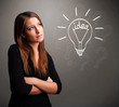 Photo: Young girl comming up with a light bubl idea sign Young girl comming up with a light bubl idea sign