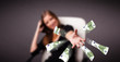 Photo: Pretty woman sitting and throwing money Pretty woman sitting and throwing money
