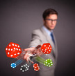 Attractive man throwing dices and chips