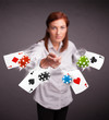 Foto: Young woman playing with poker cards and chips Young woman playing with poker cards and chips