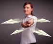 Beautiful lady throwing origami airplanes
