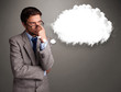 Photo: Young man thinking about cloud speech or thought bubble with cop Young man thinking about cloud speech or thought bubble with cop