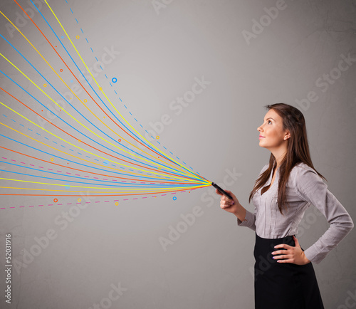 Photo: Happy girl holding a phone with colorful abstract lines Happy girl holding a phone with colorful abstract lines