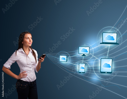 Photo: Pretty lady typing on smartphone with cloud computing Pretty lady typing on smartphone with cloud computing