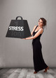 Young woman holding one ton of stress weight