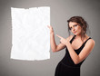 Young girl holding crumpled white paper copy space
